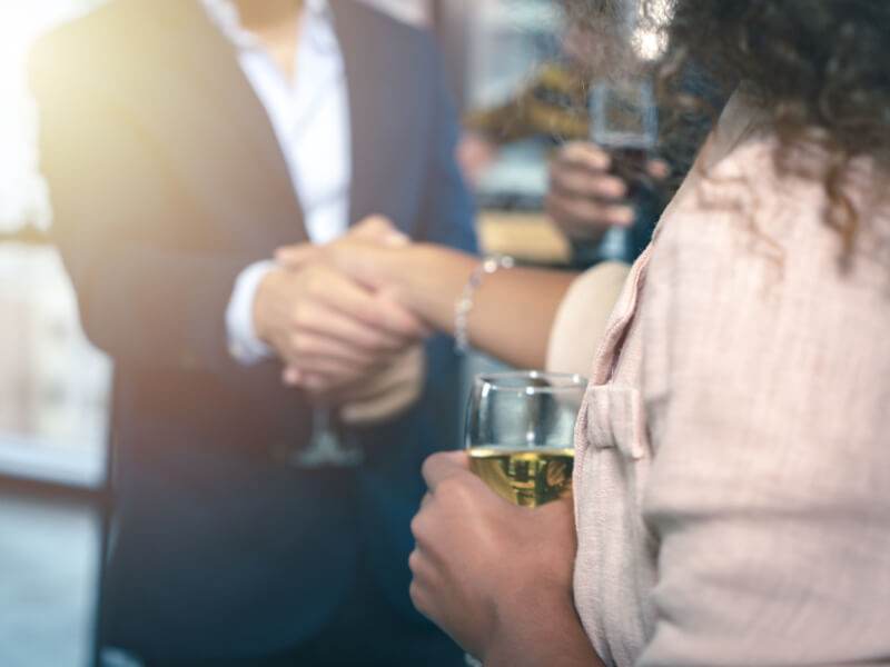 Two People shaking hands at a fundraiser